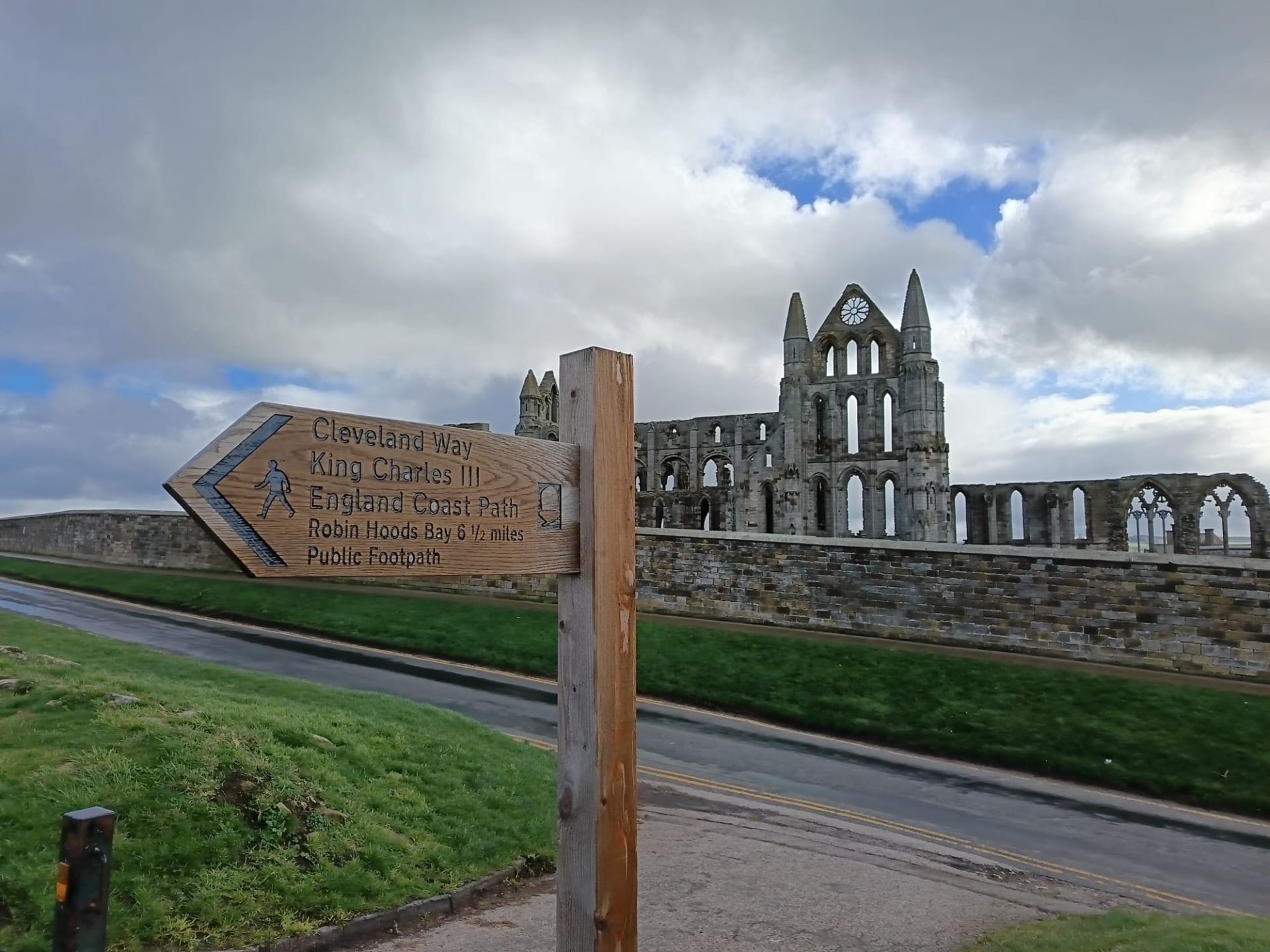Whitby Abbey and a sign for the Cleveland Way